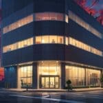 Edificio moderno de una startup tecnológica en un entorno urbano al atardecer