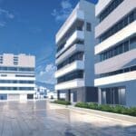 Vista de un moderno centro de innovación tecnológica en Grecia con edificios contemporáneos iluminados.