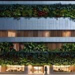 Edificio moderno con diseño vanguardista rodeado de vegetación en Barcelona