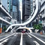 Calle moderna con vehículos autónomos circulando entre edificios urbanos futuristas