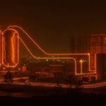 Bombas de calor gigantes en paisaje urbano futurista, ilustrando la descarbonización y energía limpia en ciudades innovadoras.