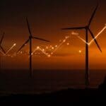 Parque eólico marino en el Reino Unido mostrando precios de energía renovable más baratos en subasta récord, impulsando el mercado energético sostenible.